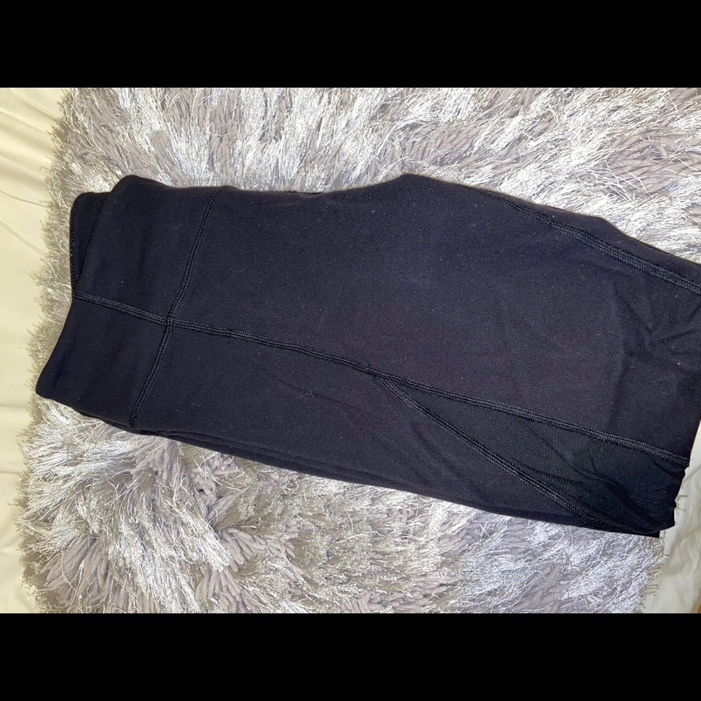 TNA black leggings with mesh design